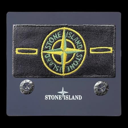 Close product photo used for a real-vs-fake Stone Island badge comparison